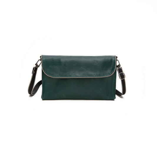 A Smateria Instinct crossbody bag in forest green