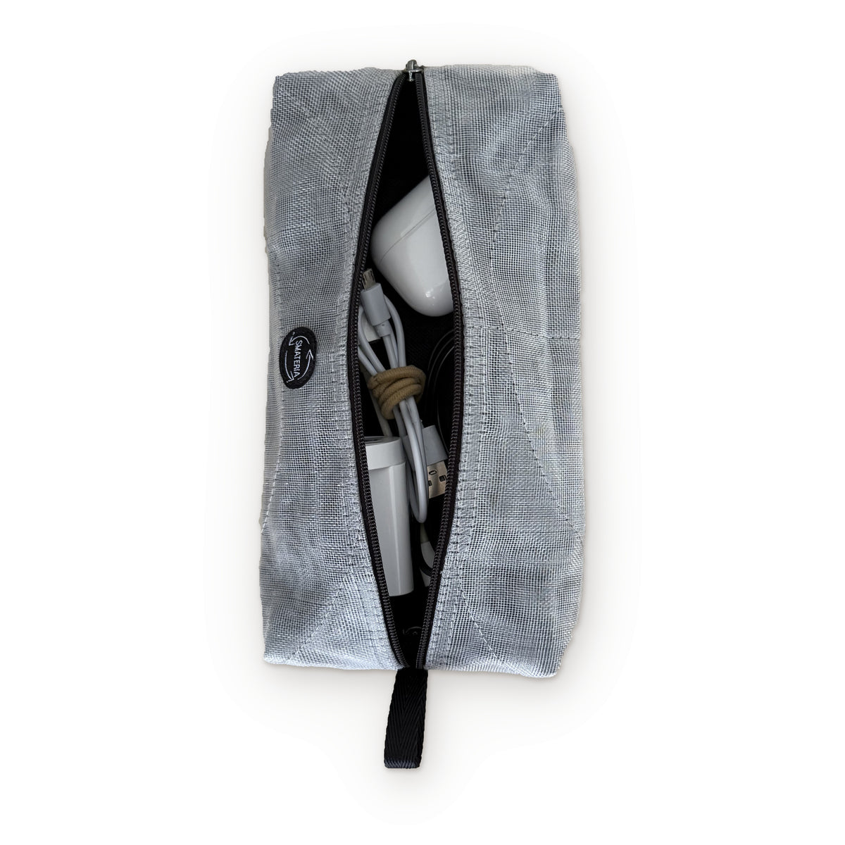 Smateria Sail organiser pouch in Silver, unzipped to show earphones, cables and a charger inside