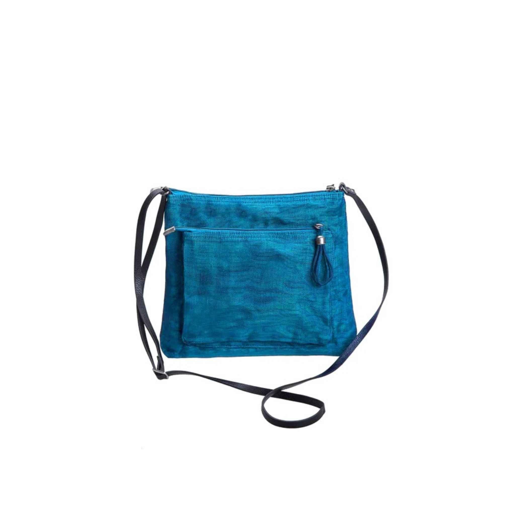 A Smateria Bustle crossbody bag in Petrol Blue